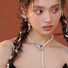 Колье Kaitin Jewelry из бусин искусственного жемчуга с подвеской-птичкой и цирконами